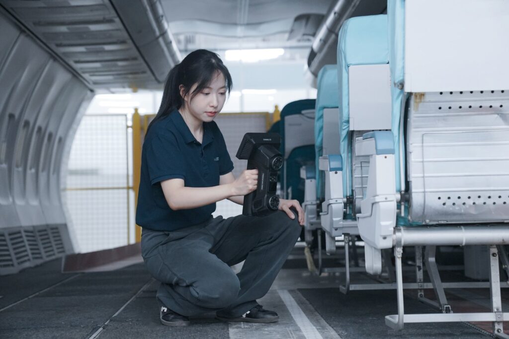 FreeScan Omni inspecting aircraft skin in a maintenance hangar